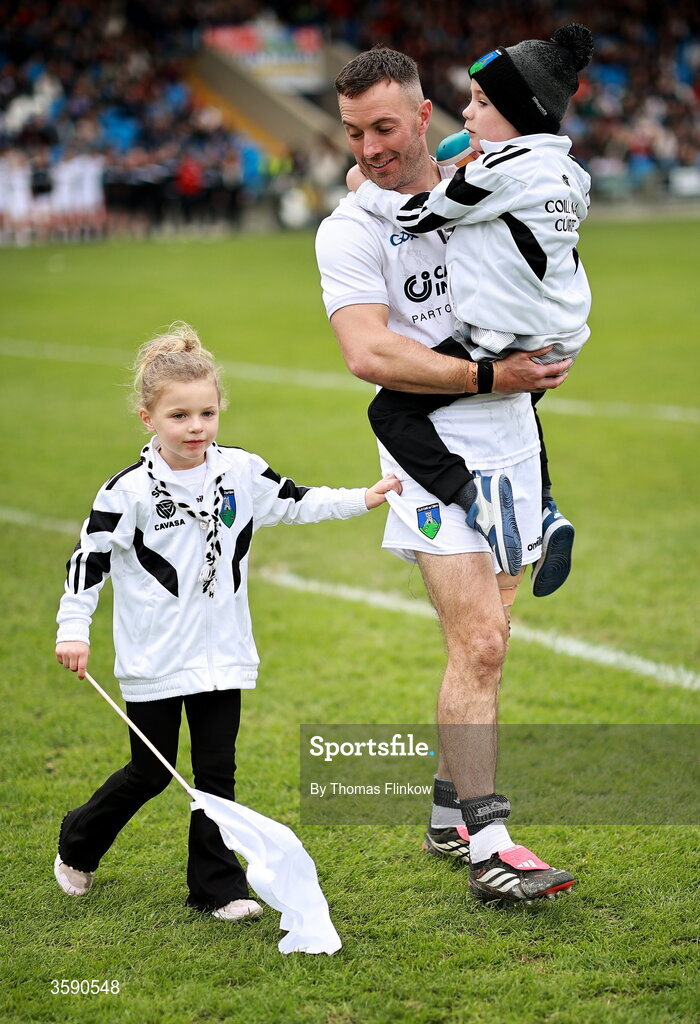 11 October 2026; Niall Donoher of Courtwood with daughter sophie, age 5, and son Dan, age 7, in the parade before the Laois County Senior Club Football Championship final match between Courtwood and Portarlington at Laois Hire O'Moore Park in Portlaoise, Laois. Photo by Thomas Flinkow/Sportsfile