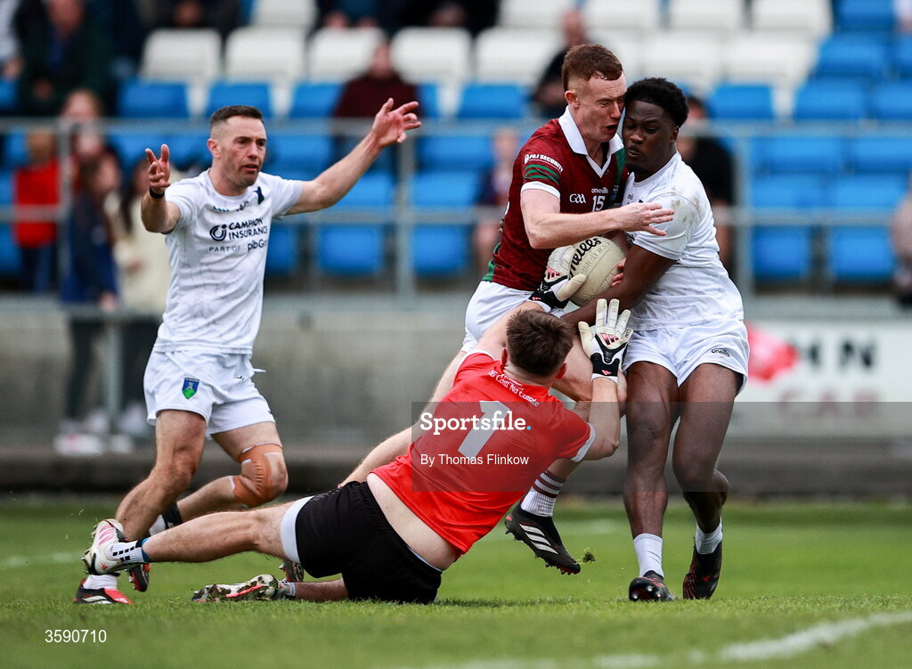 11 October 2026; Colm Murphy of Portarlington on his way to scoring his side's first goal despite the attention of Courtwood goalkeeper Matthew Byron and Collins Ugochukwu, right, during the Laois County Senior Club Football Championship final match between Courtwood and Portarlington at Laois Hire O'Moore Park in Portlaoise, Laois. Photo by Thomas Flinkow/Sportsfile