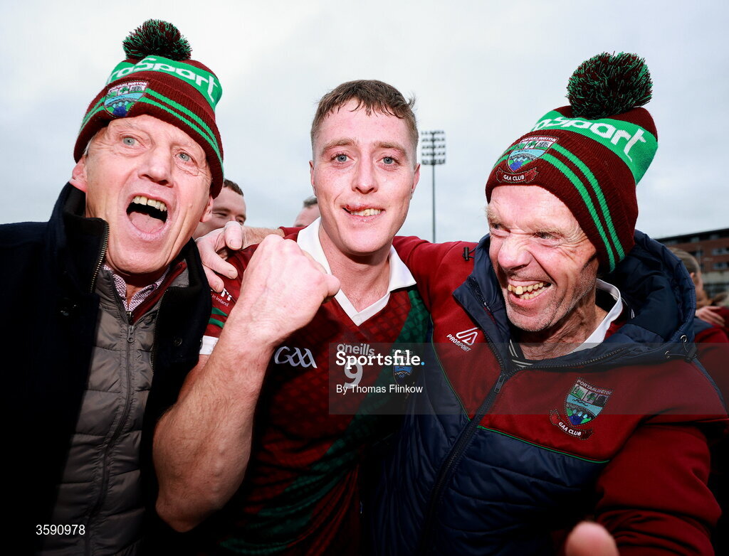 11 October 2026; Sean Byrne of Portarlington celebrates with supporters Stevie Allen, left, and Terry Lawlor after the Laois County Senior Club Football Championship final match between Courtwood and Portarlington at Laois Hire O'Moore Park in Portlaoise, Laois. Photo by Thomas Flinkow/Sportsfile