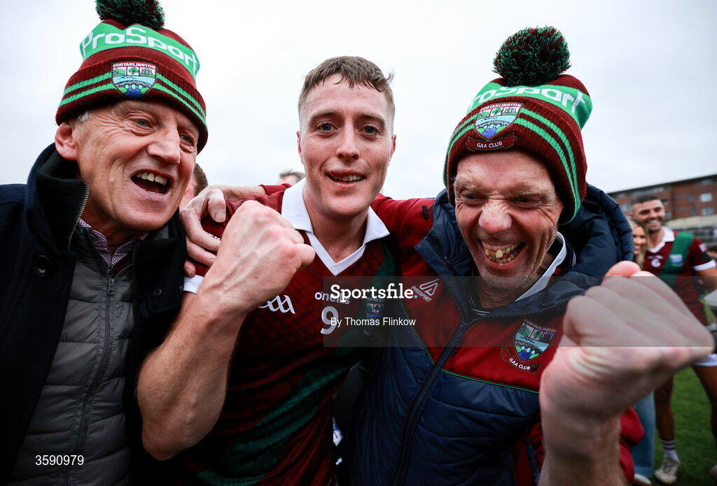 11 October 2026; Sean Byrne of Portarlington celebrates with supporters Stevie Allen, left, and Terry Lawlor after the Laois County Senior Club Football Championship final match between Courtwood and Portarlington at Laois Hire O'Moore Park in Portlaoise, Laois. Photo by Thomas Flinkow/Sportsfile