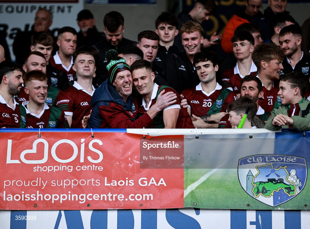 11 October 2026; Portarlington supporter Terry Lawlor celebrates with captain Patrick O Sullivan after the Laois County Senior Club Football Championship final match between Courtwood and Portarlington at Laois Hire O'Moore Park in Portlaoise, Laois. Photo by Thomas Flinkow/Sportsfile