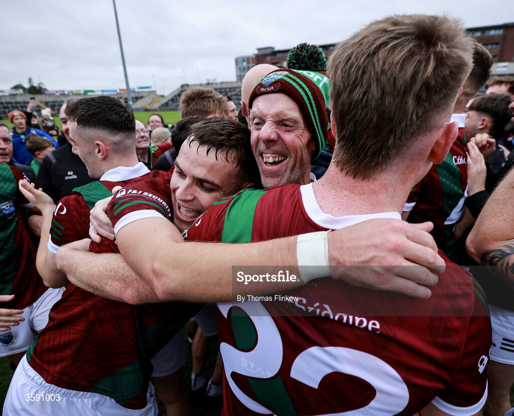 11 October 2026; Portarlington supporter Terry Lawlor celebrates with players Ronan Coffey, left, and Sean M. Corcoran after the Laois County Senior Club Football Championship final match between Courtwood and Portarlington at Laois Hire O'Moore Park in Portlaoise, Laois. Photo by Thomas Flinkow/Sportsfile