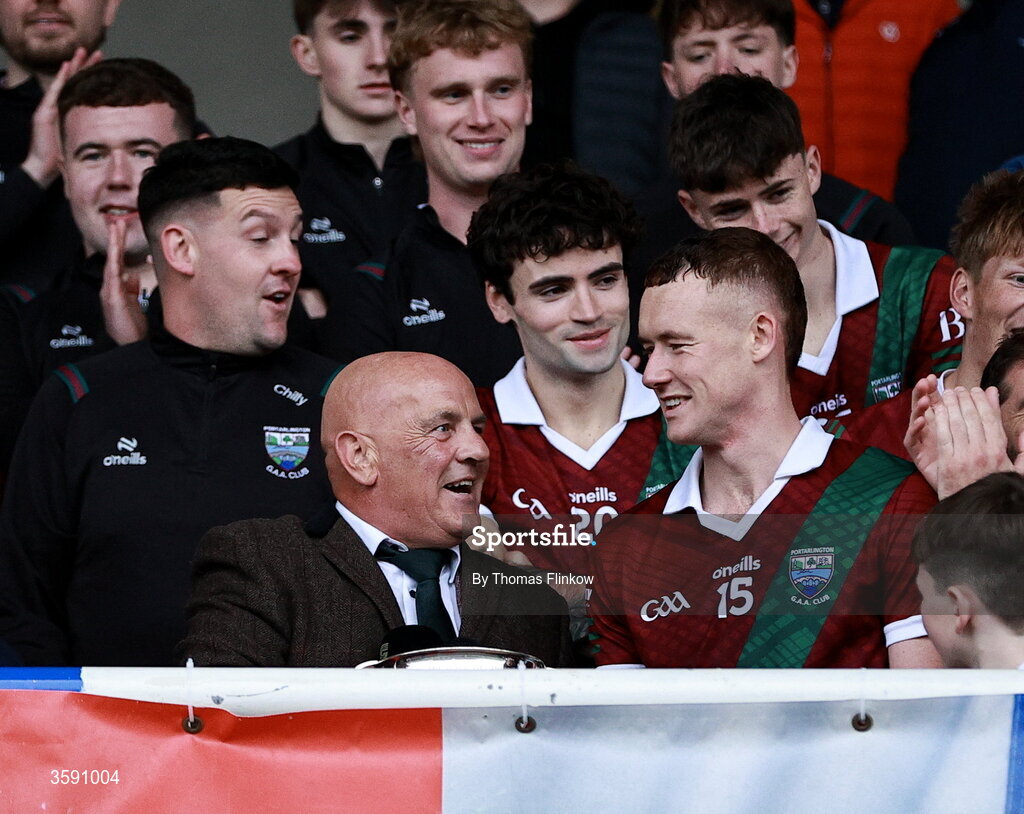 11 October 2026; Colm Murphy of Portarlington receives the player of the match award from Laois GAA chairperson PJ Kelly after the Laois County Senior Club Football Championship final match between Courtwood and Portarlington at Laois Hire O'Moore Park in Portlaoise, Laois. Photo by Thomas Flinkow/Sportsfile
