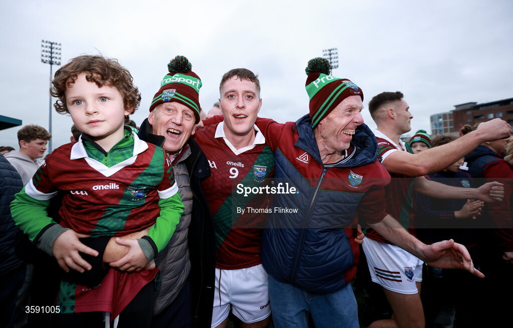 11 October 2026; Sean Byrne of Portarlington celebrates with supporters, including Stevie Allen, second from left, and Terry Lawlor, right, after the Laois County Senior Club Football Championship final match between Courtwood and Portarlington at Laois Hire O'Moore Park in Portlaoise, Laois. Photo by Thomas Flinkow/Sportsfile
