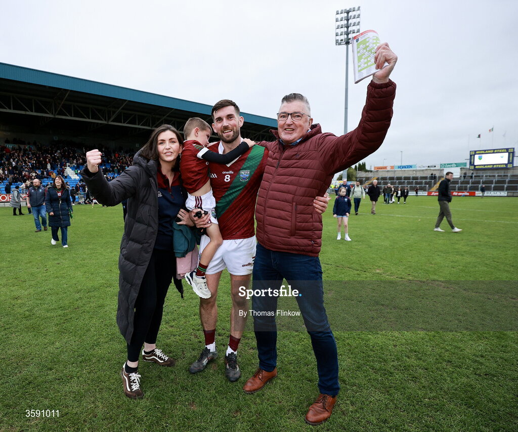 11 October 2026; Keith Bracken of Portarlington with family, including wife Aimée Bracken and father Eamonn Bracken, after the Laois County Senior Club Football Championship final match between Courtwood and Portarlington at Laois Hire O'Moore Park in Portlaoise, Laois. Photo by Thomas Flinkow/Sportsfile