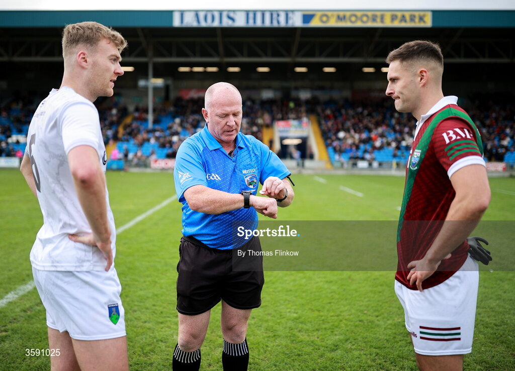 11 October 2026; Referee Des Cooney performs the coin toss in the presence of Courtwood captain Seán O'Flynn and Portarlington captain Patrick O Sullivan before the Laois County Senior Club Football Championship final match between Courtwood and Portarlington at Laois Hire O'Moore Park in Portlaoise, Laois. Photo by Thomas Flinkow/Sportsfile