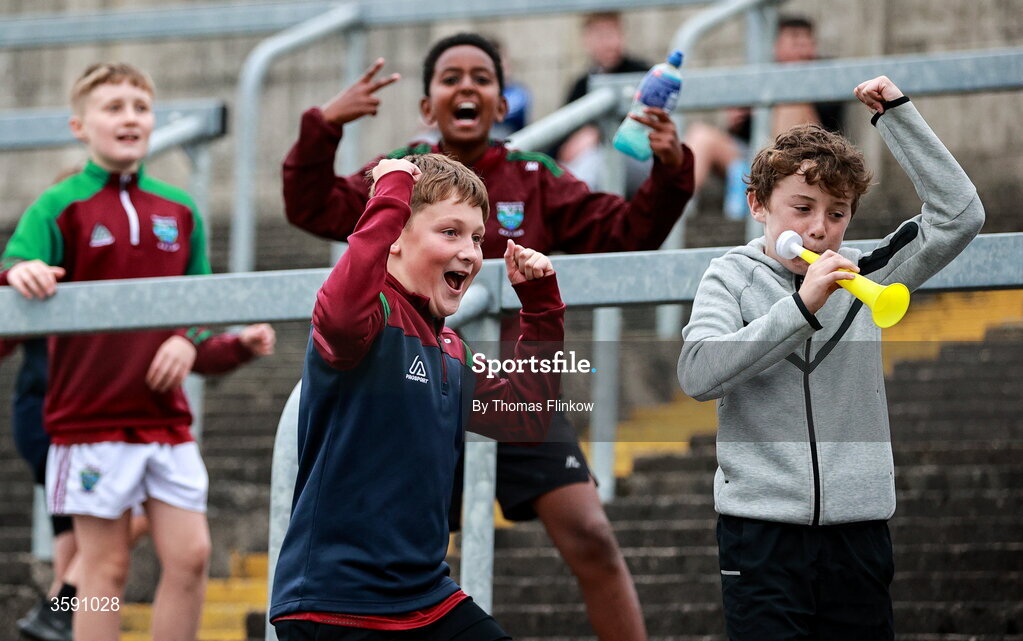11 October 2026; Young Portarlington supporters celebrate during the Laois County Senior Club Football Championship final match between Courtwood and Portarlington at Laois Hire O'Moore Park in Portlaoise, Laois. Photo by Thomas Flinkow/Sportsfile