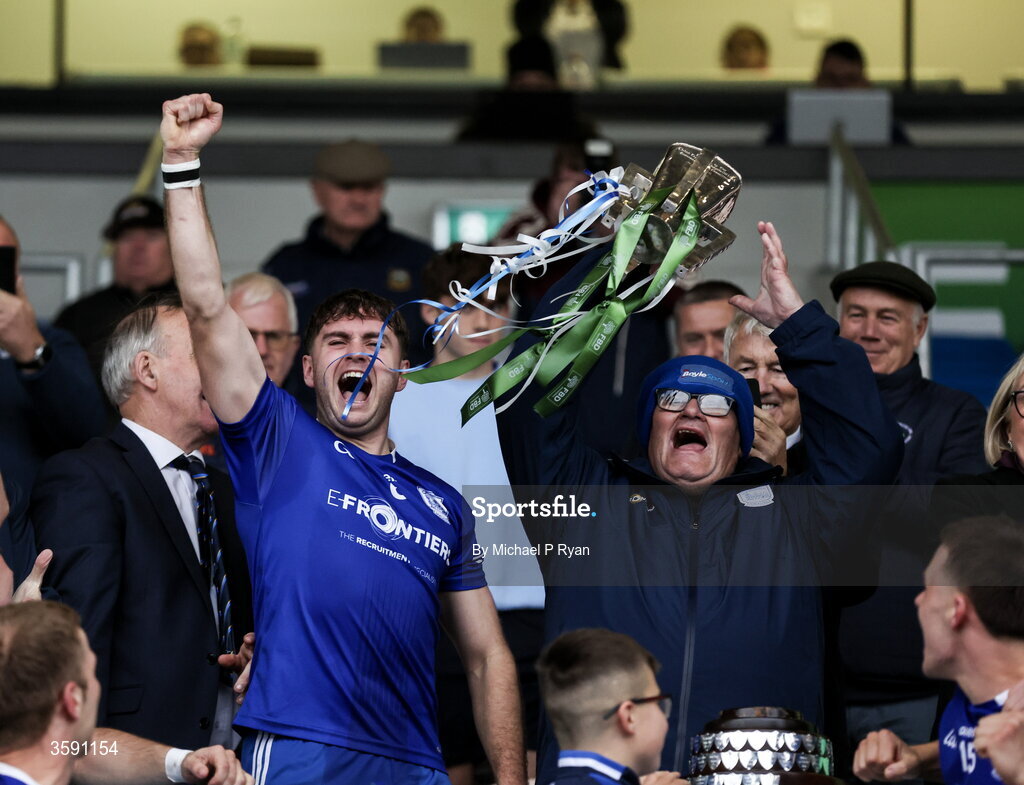 11 October 2026; Thurles Sarsfields supporter Declan Ryan lifts the Dan Breen cup alongside captain Conor Stakelum after the Tipperary County Senior Club Hurling Championship final match between Moycarkey-Borris and Thurles Sarsfields at FBD Semple Stadium in Thurles, Tipperary. Photo by Michael P Ryan/Sportsfile