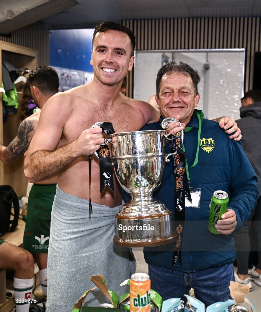 9 October 2026; Charlie Lyons of Cork City and groundsman Barry Moore with the SSE Airtrity Men's First Division trophy after the SSE Airtricity Men’s First Division match between Cork City and Finn Harps at Turner's Cross in Cork. Photo by Ben McShane/Sportsfile