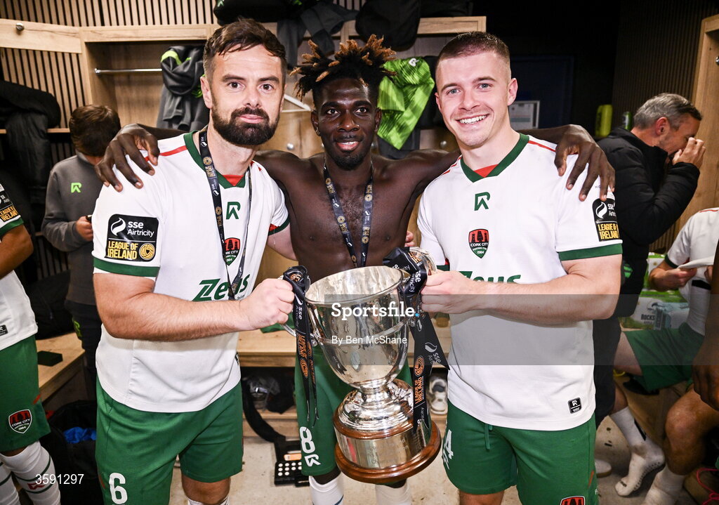9 October 2026; Cork City players, from left, Greg Bolger, Joe Aidoo and Niall O'Keeffe with the SSE Airtrity Men's First Division trophy after the SSE Airtricity Men’s First Division match between Cork City and Finn Harps at Turner's Cross in Cork. Photo by Ben McShane/Sportsfile