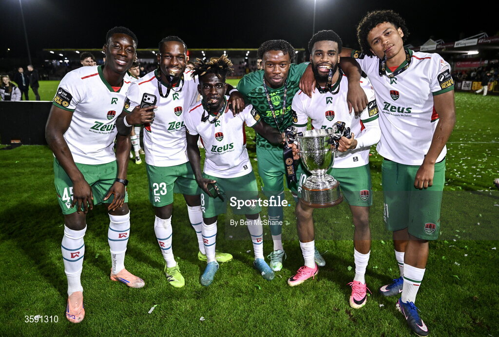 9 October 2026; Cork City players, from left, Denzell Obenge, Chris N'sa, Joe Aidoo, goalkeeper David Odumosu, Hans Mpongo and Ikechimka Manjor-George with the SSE Airtrity Men's First Division trophy after the SSE Airtricity Men’s First Division match between Cork City and Finn Harps at Turner's Cross in Cork. Photo by Ben McShane/Sportsfile