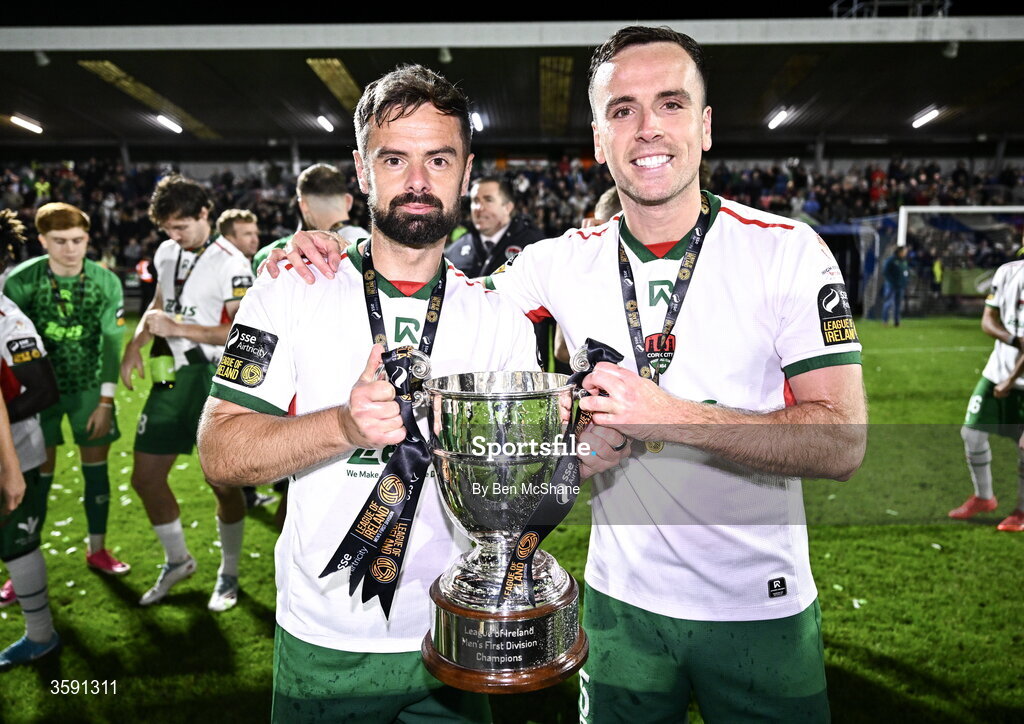 9 October 2026; Greg Bolger, left, and Charlie Lyons of Cork City with the SSE Airtrity Men's First Division trophy after the SSE Airtricity Men’s First Division match between Cork City and Finn Harps at Turner's Cross in Cork. Photo by Ben McShane/Sportsfile