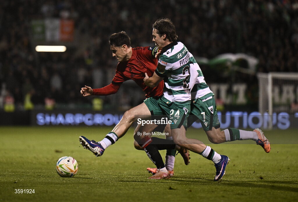 12 October 2026; Dawson Devoy of Bohemians in action against Will Fitzgerald, right, and Dylan Watts of Shamrock Rovers during the SSE Airtricity Men's Premier Division match between Shamrock Rovers and Bohemians at Tallaght Stadium in Dublin. Photo by Ben McShane/Sportsfile