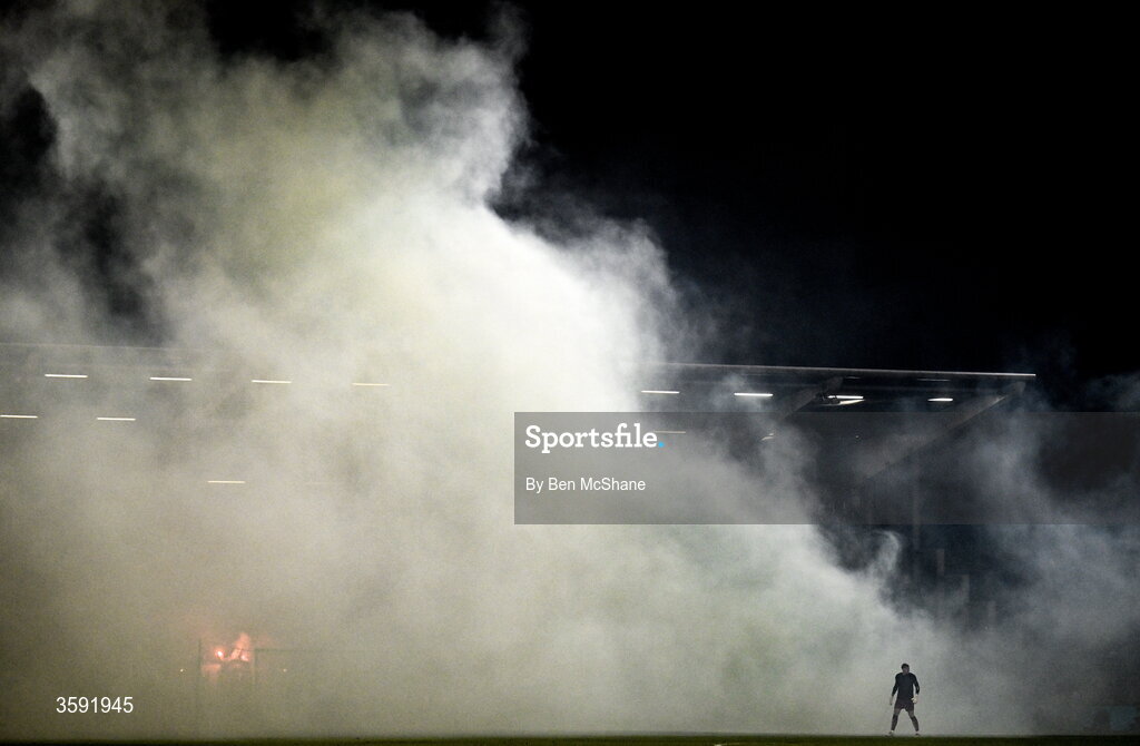 12 October 2026; Bohemians goalkeeper Paul Walters avoids the smoke set off by the Shamrock Rovers supporters during the SSE Airtricity Men's Premier Division match between Shamrock Rovers and Bohemians at Tallaght Stadium in Dublin. Photo by Ben McShane/Sportsfile