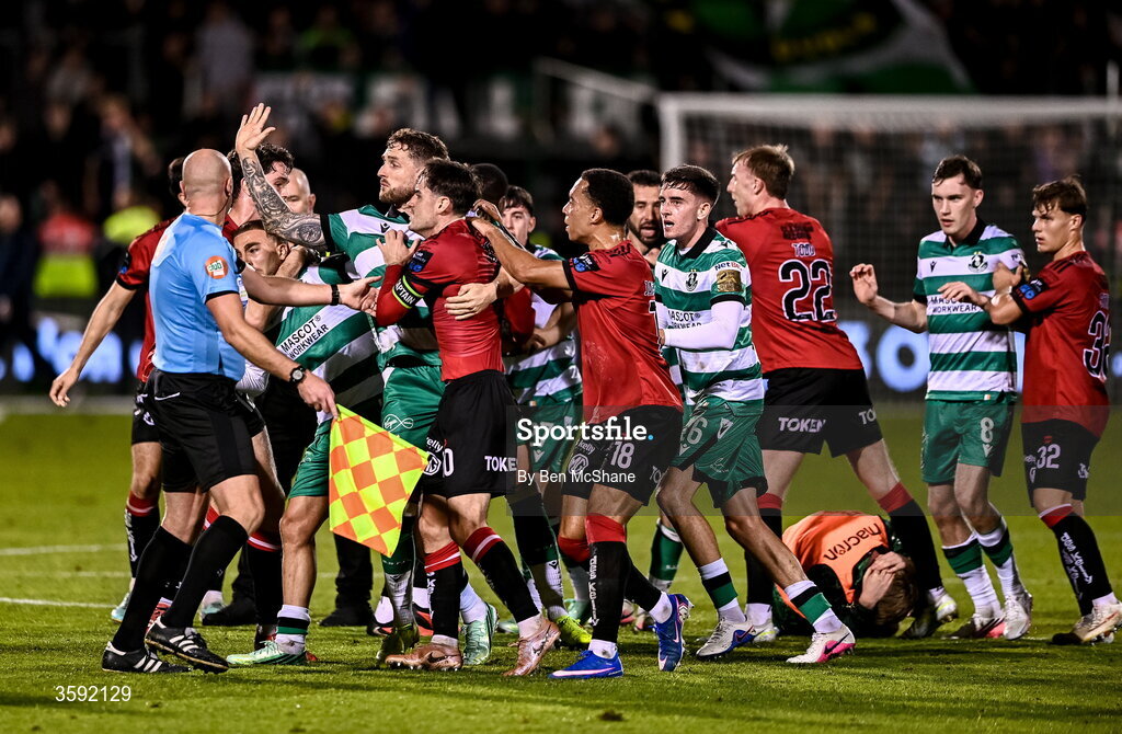 12 October 2026; Lee Grace of Shamrock Rovers restains Dawson Devoy of Bohemians after an altercation with Michael Noonan of Shamrock Rovers, who lies on the ground, after the SSE Airtricity Men's Premier Division match between Shamrock Rovers and Bohemians at Tallaght Stadium in Dublin. Photo by Ben McShane/Sportsfile