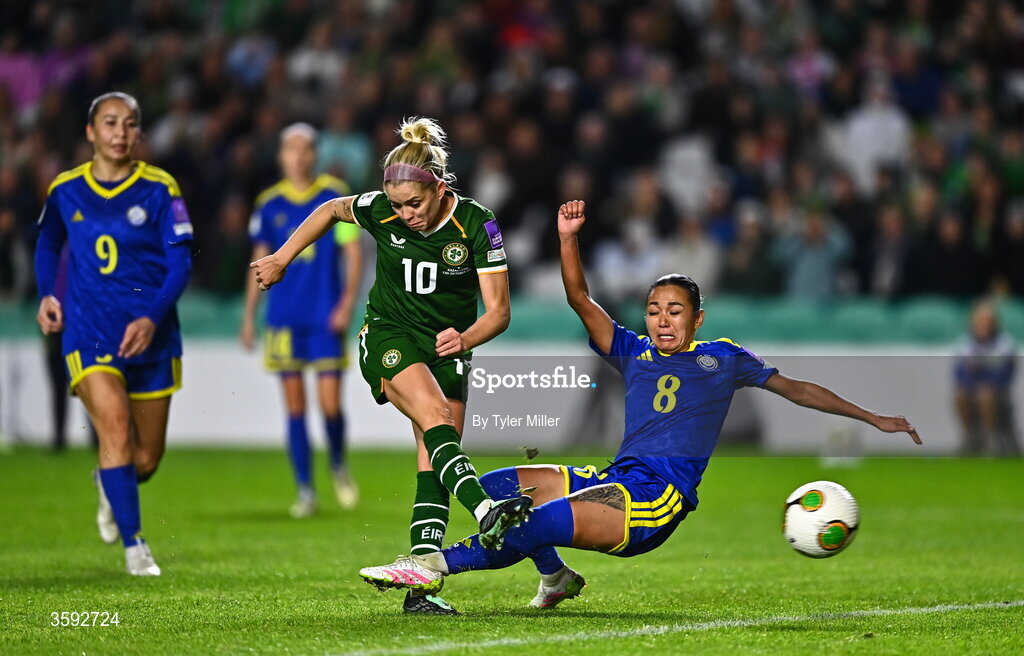 13 October 2026; Denise O’Sullivan of Republic of Ireland scores her side's fourth goal despite the tackle of Aida Gaistenova of Kazakhstan during the 2027 FIFA Women’s World Cup qualifying round 1 play-off second leg match between the Republic of Ireland and Kazakhstan at Páirc Uí Chaoimh in Cork. Photo by Tyler Miller/Sportsfile