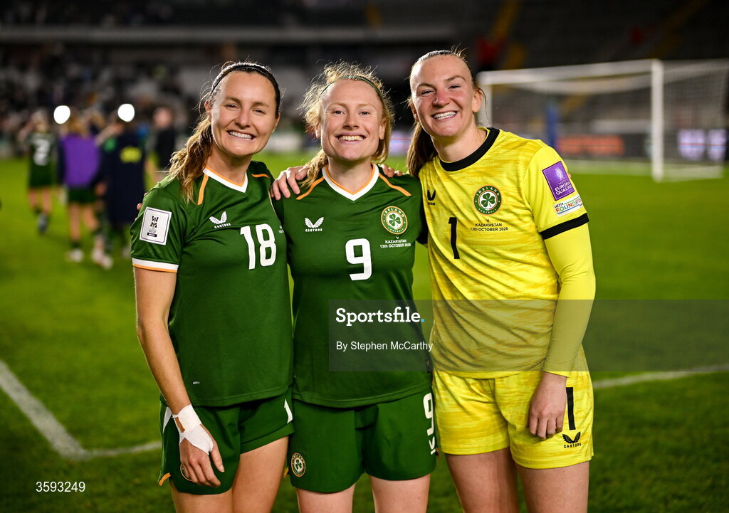 13 October 2026; Republic of Ireland players, from left, Kyra Carusa, Amber Barrett and goalkeeper Courtney Brosnan celebrate after the 2027 FIFA Women’s World Cup qualifying round 1 play-off second leg match between Republic of Ireland and Kazakhstan at SuperValu Páirc Uí Chaoimh in Cork. Photo by Stephen McCarthy/Sportsfile