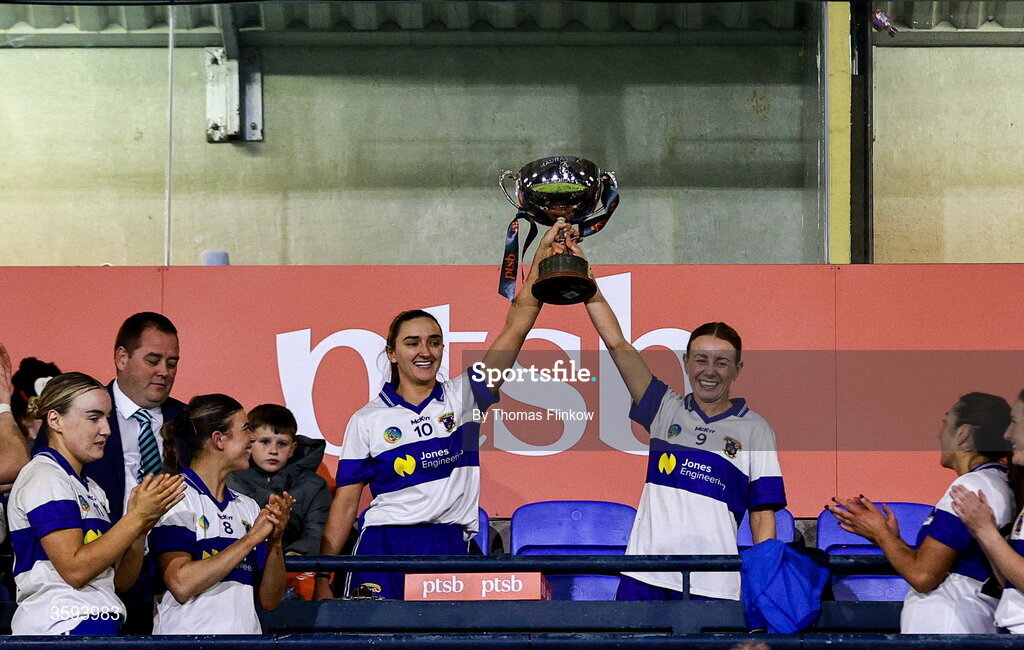 16 October 2026; St Vincent's joint captains Aine Woods, left, and Danielle Smith lift the trophy after their side's victory in the PTSB Dublin Senior Club Hurling final match between St Vincent's and St Jude's at Parnell Park in Dublin. Photo by Thomas Flinkow/Sportsfile
