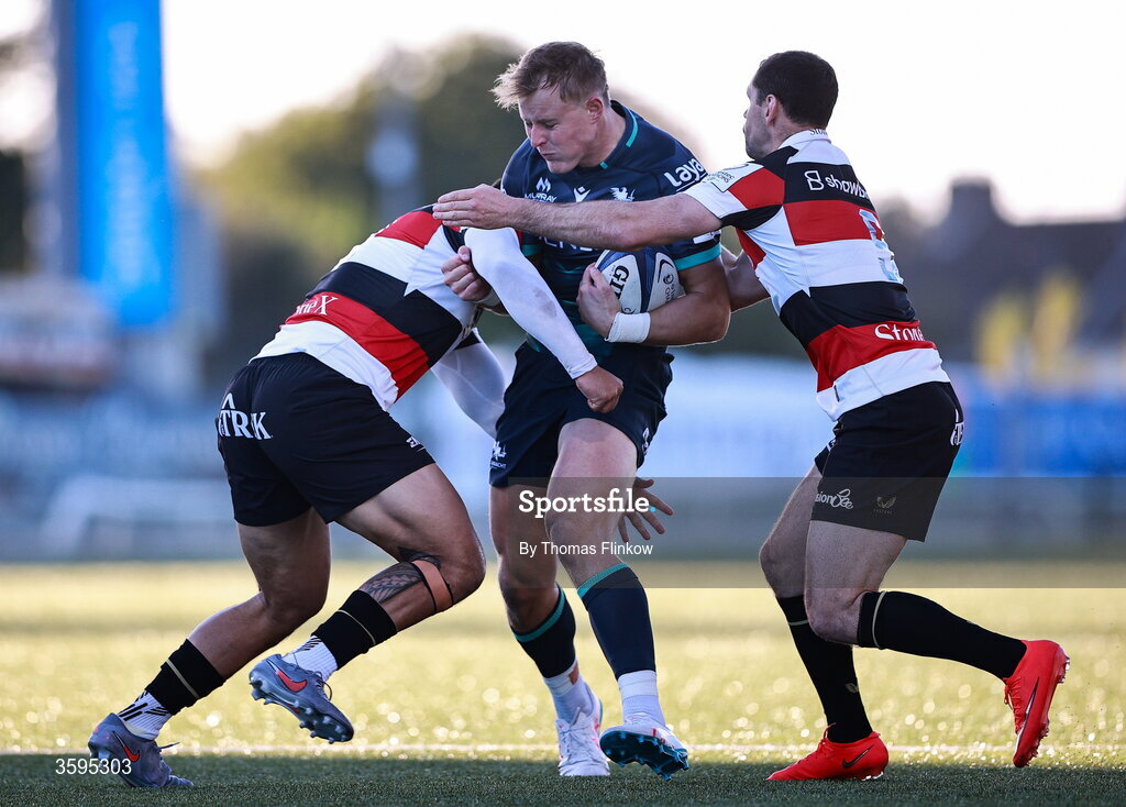 17 October 2026; Sam Gilbert of Connacht is tackled by Saracens players, from left, Jamie George and Tomos Williams during the Investec Champions Cup Round 1 match between Connacht and Saracens at Dexcom Stadium in Galway. Photo by Thomas Flinkow/Sportsfile