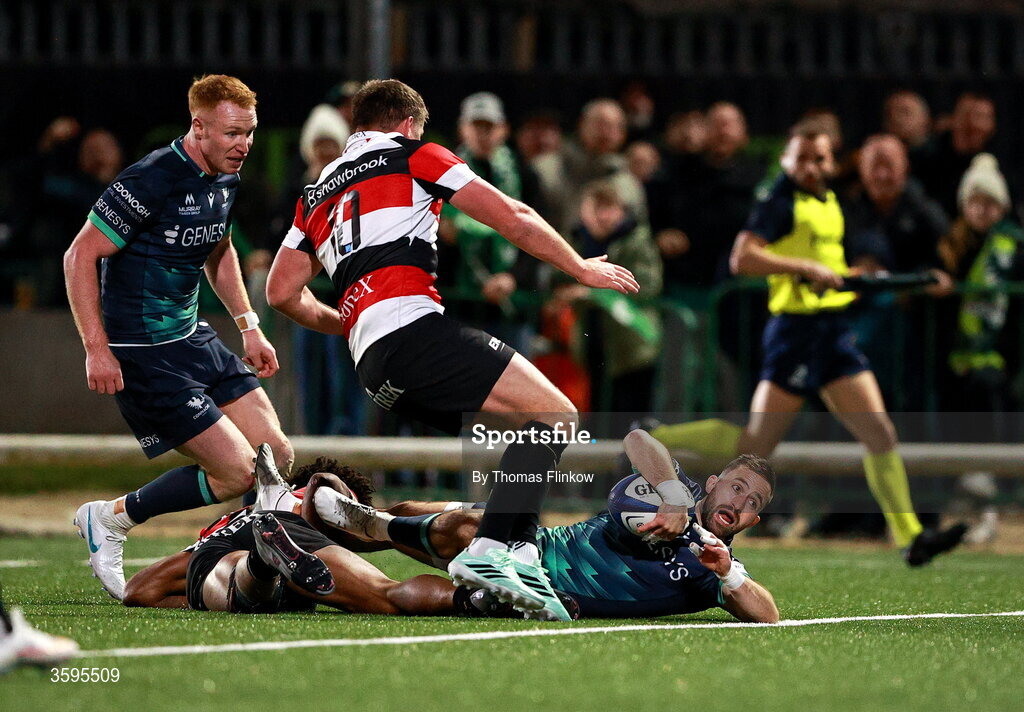 17 October 2026; Caolin Blade of Connacht scores his side's sixth try despite the attention of Saracens players, from left, Noah Caluori and Owen Farrell during the Investec Champions Cup Round 1 match between Connacht and Saracens at Dexcom Stadium in Galway. Photo by Thomas Flinkow/Sportsfile