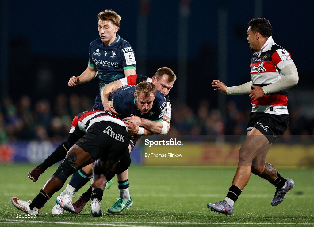 17 October 2026; Sam Gilbert of Connacht is tackled by Saracens players Rotimi Segun, front, and Nick Tompkins during the Investec Champions Cup Round 1 match between Connacht and Saracens at Dexcom Stadium in Galway. Photo by Thomas Flinkow/Sportsfile