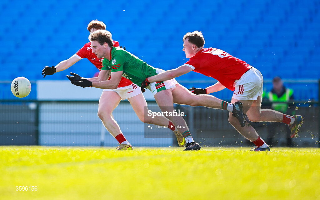 18 October 2026; Jack Downey of Pádraig Pearses is tackled by Pádraig Pearses players Conor Harley, right, and Adam McGreal, back, during the Roscommon County Senior Club Football Championship final match between Pádraig Pearses and St Brigid's at King & Moffatt Dr Hyde Park in Roscommon. Photo by Thomas Flinkow/Sportsfile