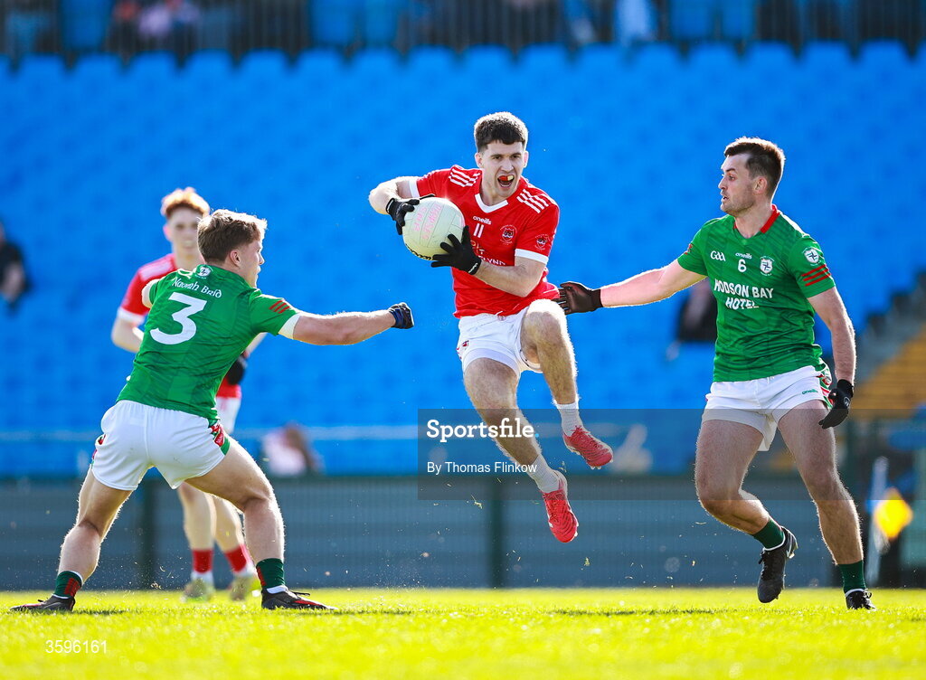 18 October 2026; Lorcán Daly of Pádraig Pearses in action against St Brigid's players Pearse Frost, left, and Brian Stack during the Roscommon County Senior Club Football Championship final match between Pádraig Pearses and St Brigid's at King & Moffatt Dr Hyde Park in Roscommon. Photo by Thomas Flinkow/Sportsfile