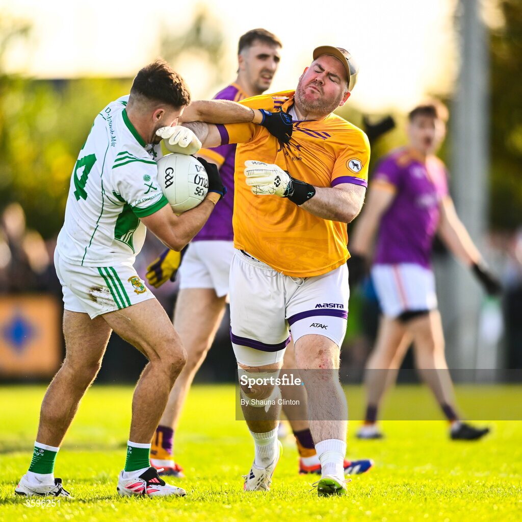 18 October 2026; Wolfe Tones goalkeeper Ciaráin Ó Gallachóir and Stephen Carton of Donaghmore/ Ashbourne tussle during the Meath County Senior Club Football Championship final match between Wolfe Tones and Donaghmore/ Ashbourne at Donaghmore-Ashbourne GAA Club in Ashbourne, Meath. Photo by Shauna Clinton/Sportsfile