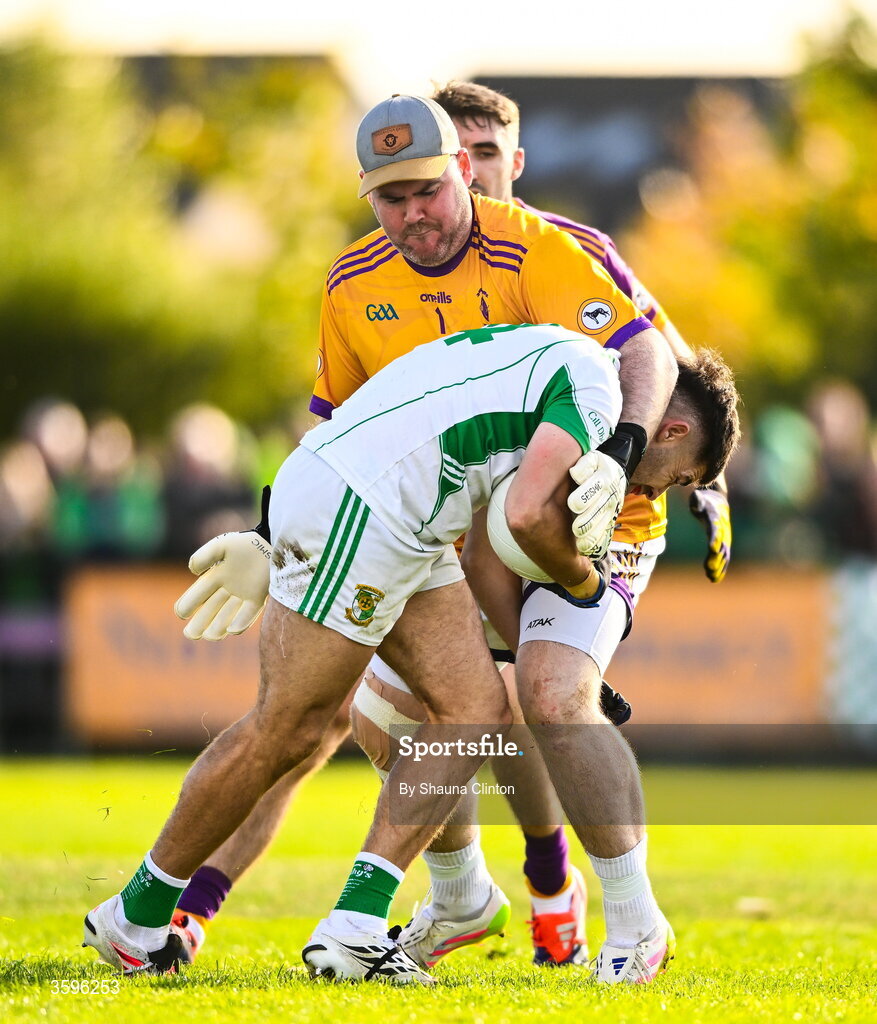 18 October 2026; Wolfe Tones goalkeeper Ciaráin Ó Gallachóir and Stephen Carton of Donaghmore/ Ashbourne tussle during the Meath County Senior Club Football Championship final match between Wolfe Tones and Donaghmore/ Ashbourne at Donaghmore-Ashbourne GAA Club in Ashbourne, Meath. Photo by Shauna Clinton/Sportsfile