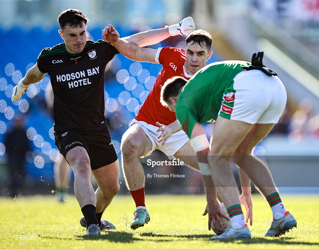 18 October 2026; David Murray of Pádraig Pearses in action against St Brigid's goalkeeper Conor Carroll and Shane Cunnane during the Roscommon County Senior Club Football Championship final match between Pádraig Pearses and St Brigid's at King & Moffatt Dr Hyde Park in Roscommon. Photo by Thomas Flinkow/Sportsfile