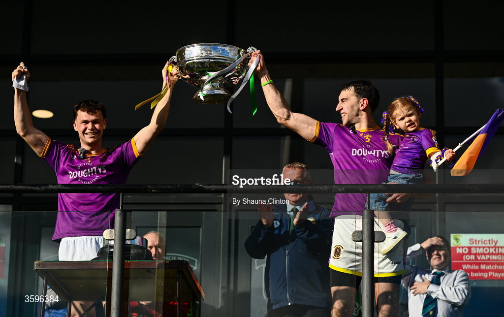 18 October 2026; Wolfe Tones captains Oisín Martin, left, and Shane McGlynn Shane lift the cup after their side's victory in the Meath County Senior Club Football Championship final match between Wolfe Tones and Donaghmore/ Ashbourne at Donaghmore-Ashbourne GAA Club in Ashbourne, Meath. Photo by Shauna Clinton/Sportsfile