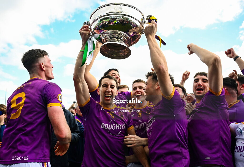 18 October 2026; Wolfe Tones players celebrate with the Keegan Cup after their side's victory in the Meath County Senior Club Football Championship final match between Wolfe Tones and Donaghmore/ Ashbourne at Donaghmore-Ashbourne GAA Club in Ashbourne, Meath. Photo by Shauna Clinton/Sportsfile