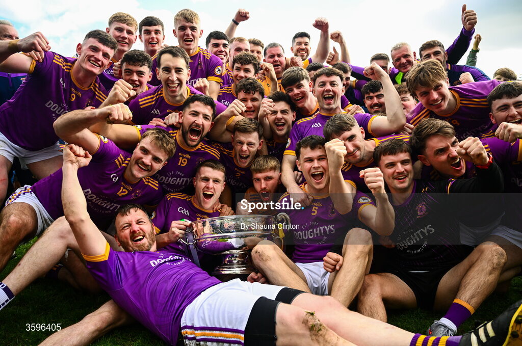 18 October 2026; Wolfe Tones players celebrate with the Keegan Cup after their side's victory in the Meath County Senior Club Football Championship final match between Wolfe Tones and Donaghmore/ Ashbourne at Donaghmore-Ashbourne GAA Club in Ashbourne, Meath. Photo by Shauna Clinton/Sportsfile