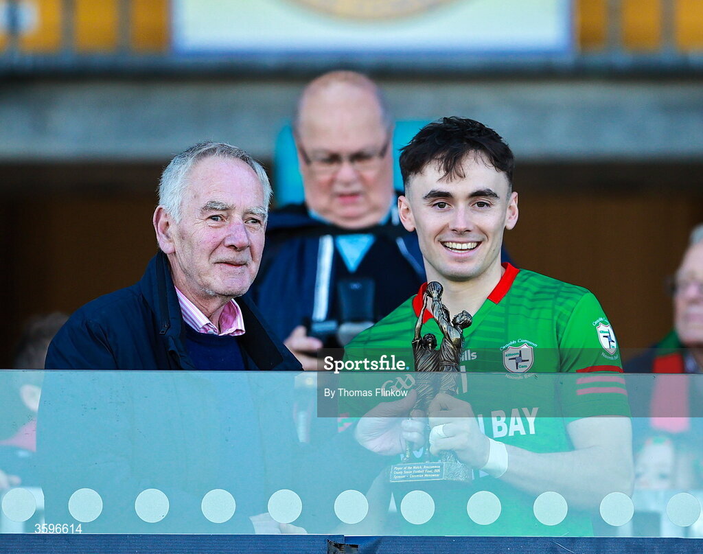 18 October 2026; John Corcoran presents the player of the match award to Conor Hand of St Brigid's after the Roscommon County Senior Club Football Championship final match between Pádraig Pearses and St Brigid's at King & Moffatt Dr Hyde Park in Roscommon. Photo by Thomas Flinkow/Sportsfile