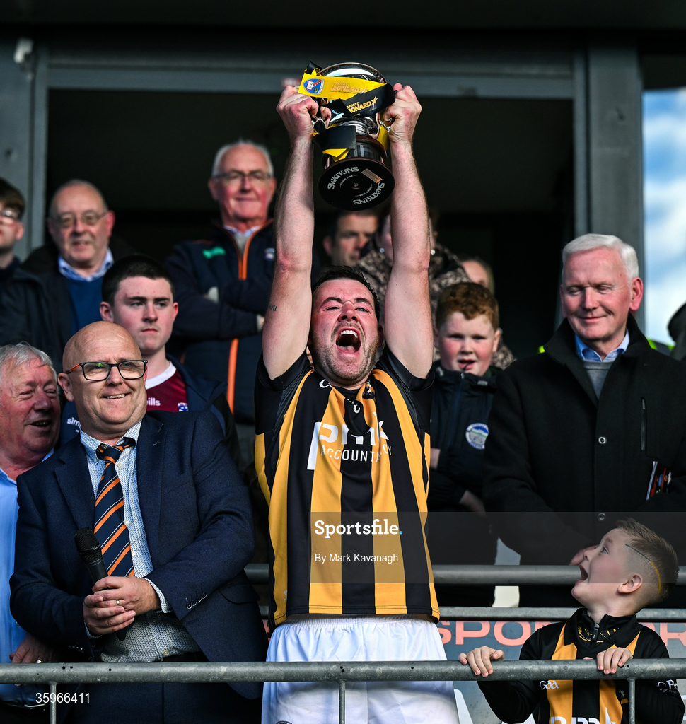 18 October 2026; Callum Cumiskey of Crossmaglen Rangers lifts the Gerry Fagan Cup after his side's win in the Armagh County Senior Club Football Championship final match between Killeavy St Moninna and Crossmaglen Rangers at BOX-IT Athletic Grounds in Armagh. Photo by Mark Kavanagh/Sportsfile