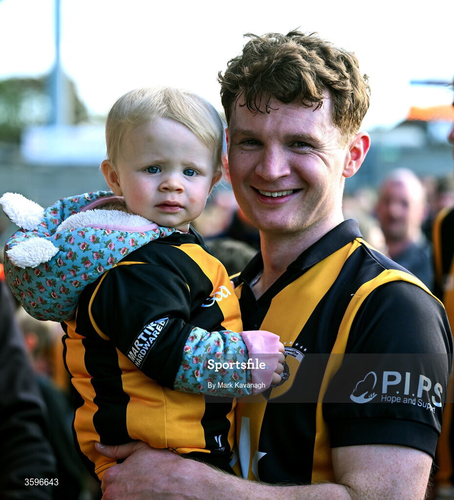 18 October 2026; Padraig Stuttard of Crossmaglen Rangers celebrates with his son after his side's win in the Armagh County Senior Club Football Championship final match between Killeavy St Moninna and Crossmaglen Rangers at BOX-IT Athletic Grounds in Armagh. Photo by Mark Kavanagh/Sportsfile