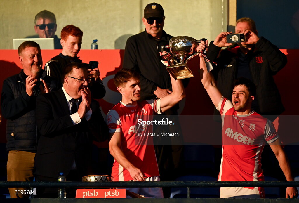 18 October 2026; Cuala players Michael Fitzsimons, left, and Conor O’Brien lift the cup after their side's victory in the PTSB Dublin County Senior Club Football Championship final match between Castleknock and Cuala at Parnell Park in Dublin. Photo by Piaras Ó Mídheach/Sportsfile