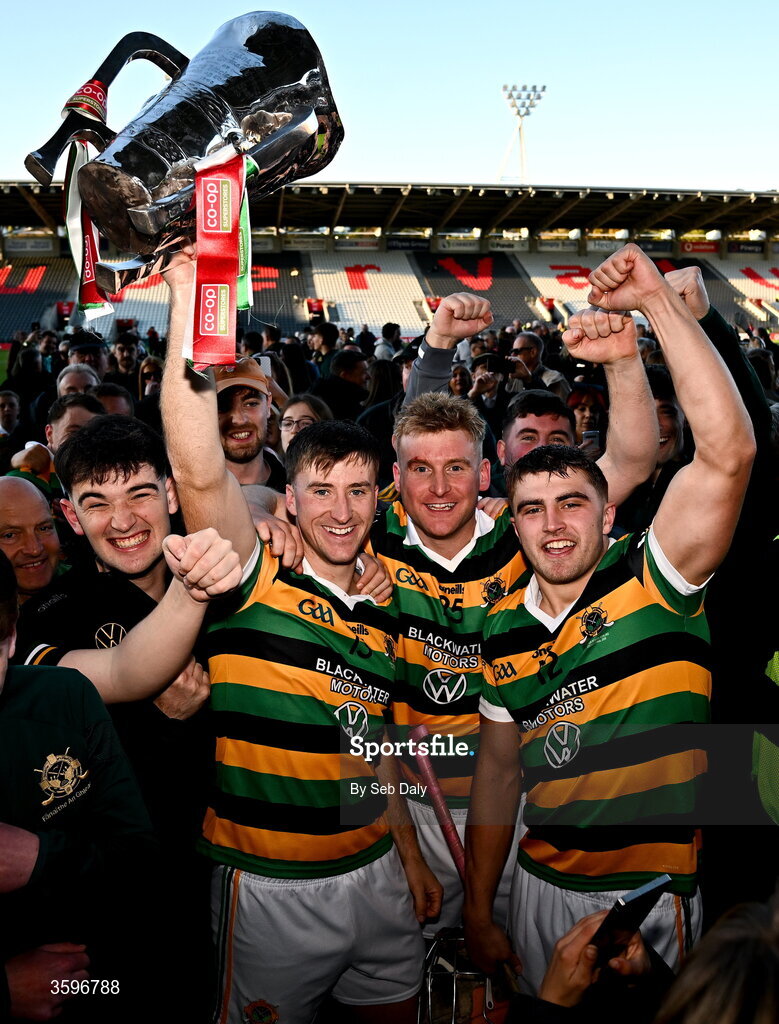 18 October 2026; Glen Rovers players, from left, Simon Kennefick, David Dooling, and Micheál Mullins celebrate with the Seán Óg Murphy Cup after their side's victory in the Cork County Premier Senior Club Hurling Championship final match between Glen Rovers and St Finbarr's at SuperValu Páirc Uí Chaoimh in Cork. Photo by Seb Daly/Sportsfile