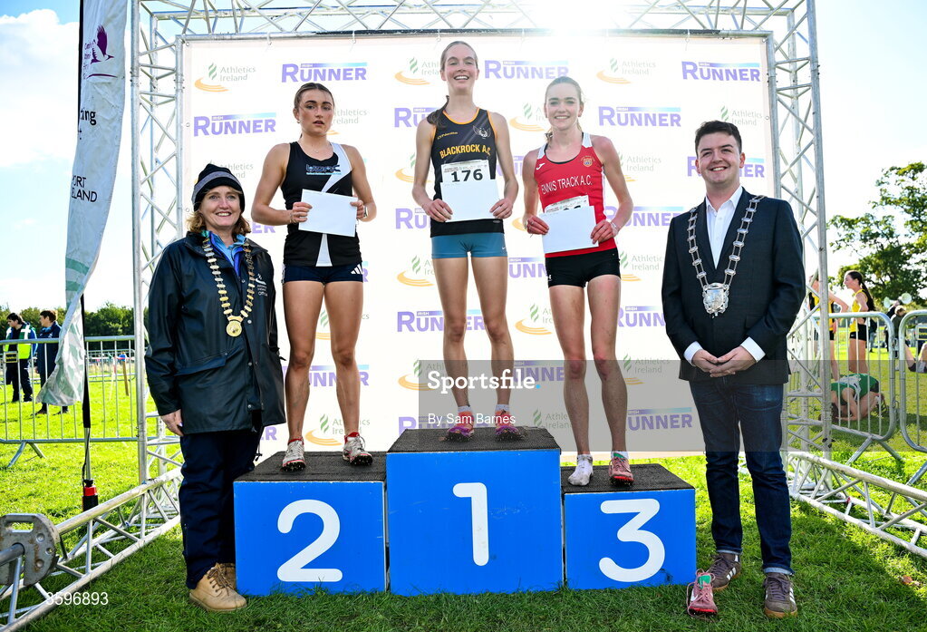 18 October 2026; U20 Women 4500m top three finishers, Megan Brunt of Blackrock AC, Dublin, centre, first, Emma Hickey of United Striders AC, left, second, and Claire O’Grady of Ennis Track AC, right, third, alongside Athletics Ireland President Brid Golden and Deputy Mayor of Fingal Luke Corkery during the Autumn Open Cross Country International at the Sport Ireland Campus in Dublin. Photo by Sam Barnes/Sportsfile