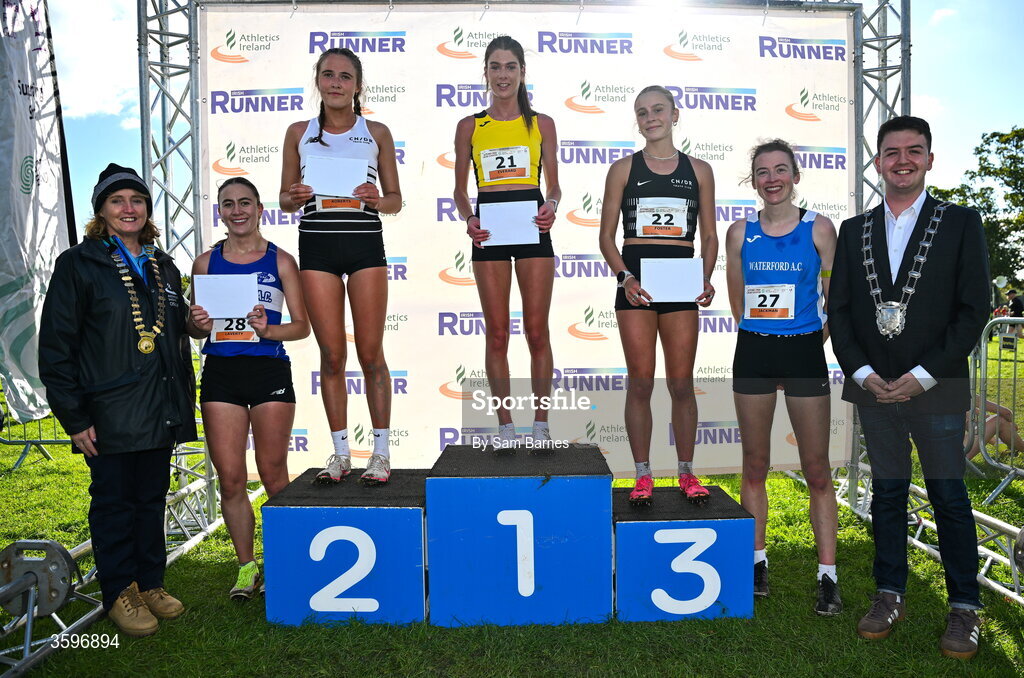 18 October 2026; Athletics Ireland President Brid Golden, and Deputy Mayor of Fingal Luke Corkery with Senior Women 6000m top 5 finishers, Fiona Everard of Bandon AC, Cork, centre, first, Roise Roberts of CNDR Track AC, third from left, second, Kirsti Charlotte Foster of CNDR Track AC, third from right, third, Cara Laverty of Finn Valley AC, Donegal, second from left, fourth and Patricia Jackman of Waterford AC, second from right, fifth, during the Autumn Open Cross Country International at the Sport Ireland Campus in Dublin. Photo by Sam Barnes/Sportsfile
