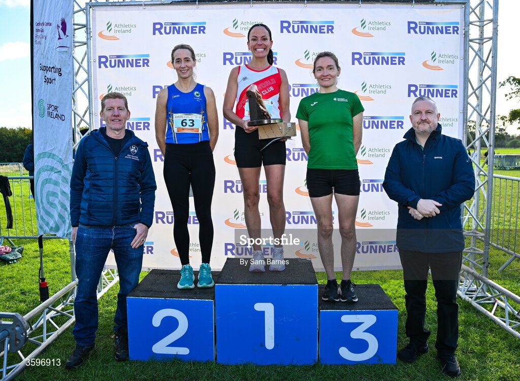 18 October 2026; Irish Master Athletics Association President Ronan Gately, left, and Shane McNamara, right, with Master Women 6000m top three finishers, Lisa Madden of Sportsworld AC, Dublin, centre, first, Fiona Gettings of Longford AC, left, second, and Fiona Roche of Raheny Shamrock AC, Dublin, right, third, during the Autumn Open Cross Country International at the Sport Ireland Campus in Dublin. Photo by Sam Barnes/Sportsfile