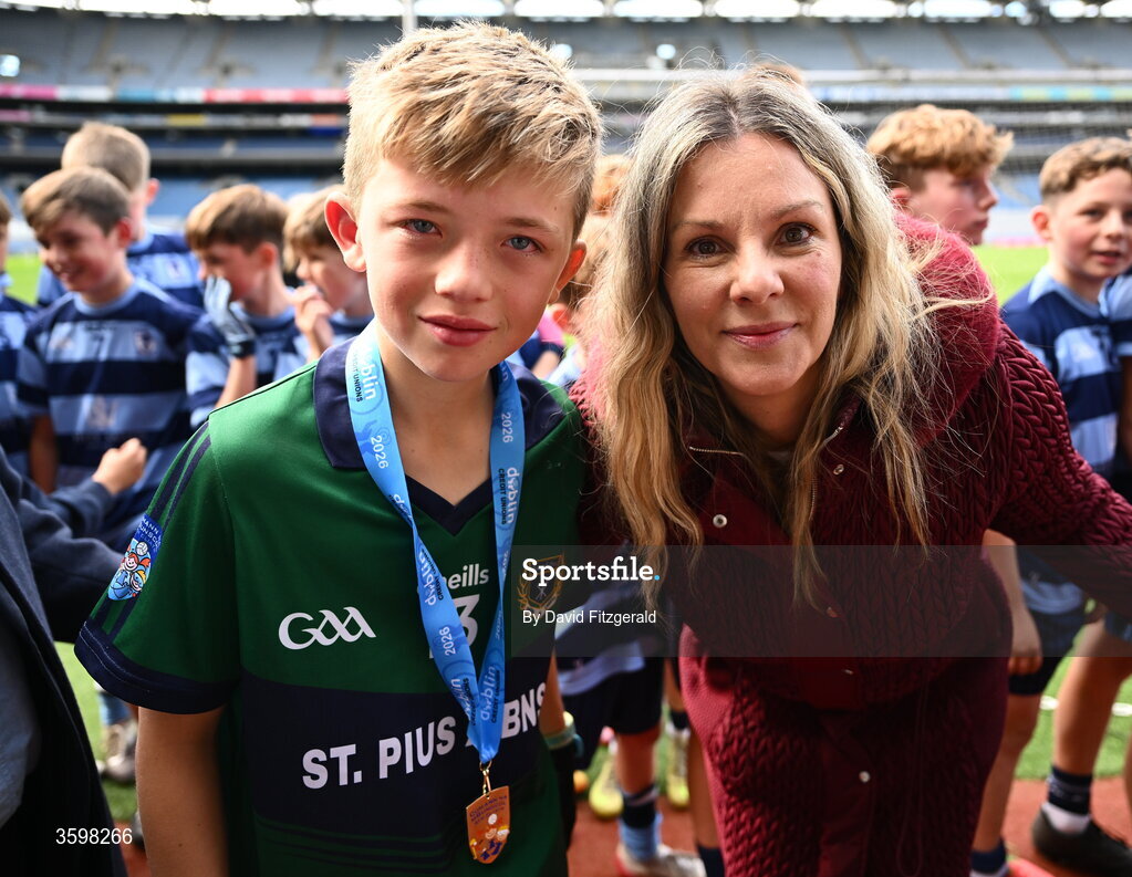 20 October 2026; RTE Presenter Marie Crowe with Aiden Bastick of St Pius X BNS during day two of the Cumann na mBunscol 2026 Autumn Football finals match between St Pius X Boys National School and St. Helen's SNS at Croke Park in Dublin. Photo by David Fitzgerald/Sportsfile