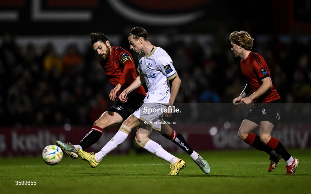 23 October 2026; Daniel Kelly of Shelbourne in action against Jordan Flores, left, and Harry Vaughan of Bohemians during the SSE Airtricity Men's Premier Division match between Bohemians and Shelbourne at Dalymount Park in Dublin. Photo by Ben McShane/Sportsfile