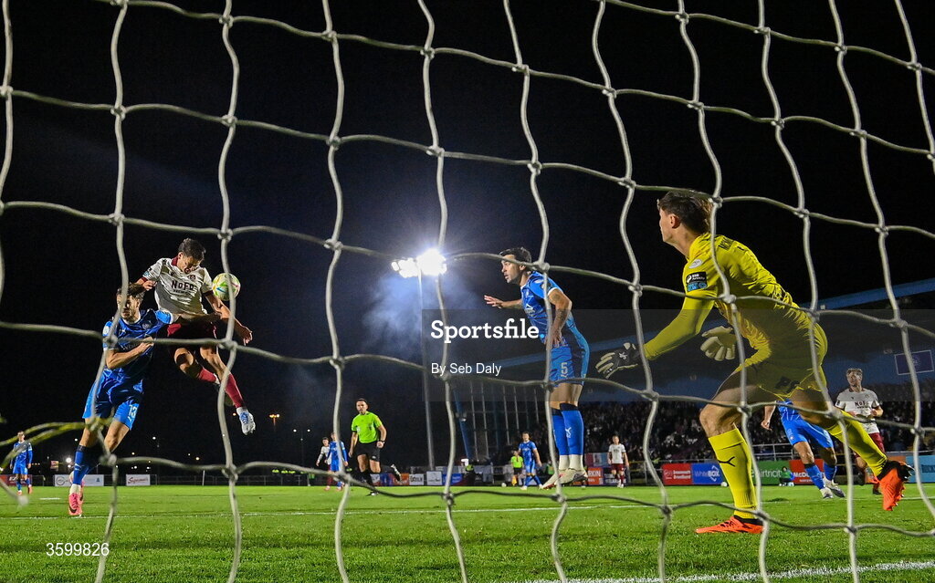 23 October 2026; Leo Burney of Drogheda United scores his side's first goal, past Waterford goalkeeper Stephen McMullan, during the SSE Airtricity Men's Premier Division match between Waterford and Drogheda United at RSC in Waterford. Photo by Seb Daly/Sportsfile
