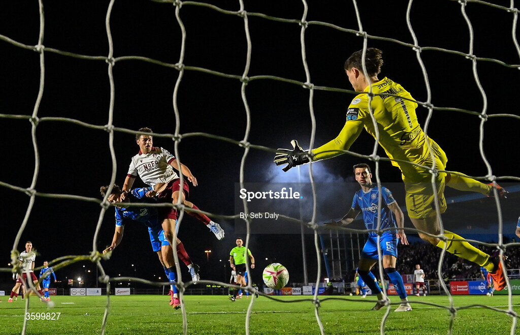 23 October 2026; Leo Burney of Drogheda United scores his side's first goal, past Waterford goalkeeper Stephen McMullan, during the SSE Airtricity Men's Premier Division match between Waterford and Drogheda United at RSC in Waterford. Photo by Seb Daly/Sportsfile