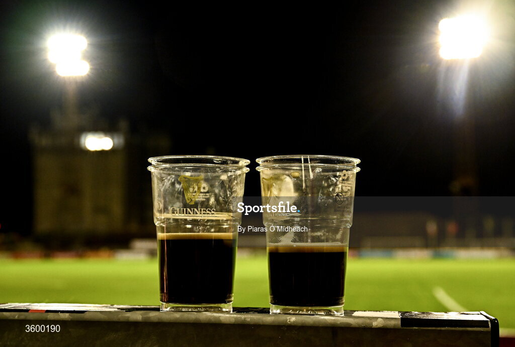 23 October 2026; Two pints left behind in the ground, with two of the floodlights in Dalymount Park seen behind, which had been in operation since 1962, on their last Friday night match before upcoming demolition, after the SSE Airtricity Men's Premier Division match between Bohemians and Shelbourne at Dalymount Park in Dublin. Photo by Piaras Ó Mídheach/Sportsfile
