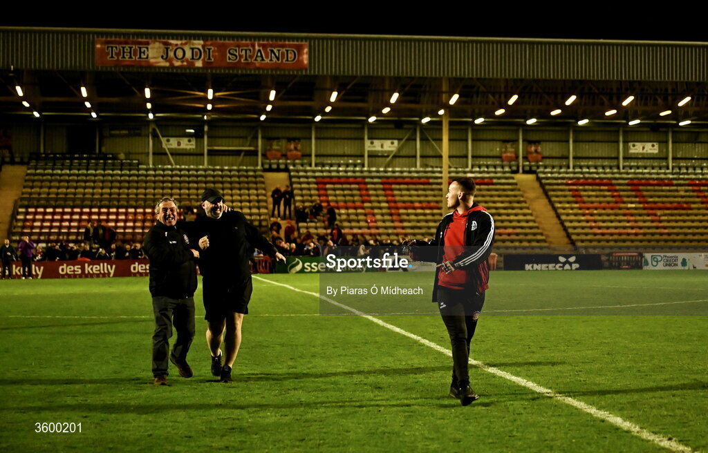 23 October 2026; Bohemians and Dalymount Park legend Dermot Cassin, left, Derek Sweetman, bar manager, centre, and Lee Grace, match day co-ordinator, make their way across the pitch to turn off the floodlights, with Cassin having the honour, after the last Friday night match under lights at Dalymount Park before upcoming demolition, after the SSE Airtricity Men's Premier Division match between Bohemians and Shelbourne at Dalymount Park in Dublin. Photo by Piaras Ó Mídheach/Sportsfile