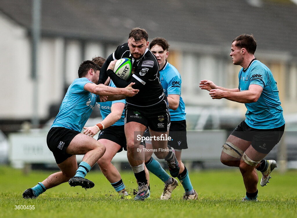 24 October 2026; Ben Moxham of Ballymena in action against Galwegians players Tom Walsh, left, Ollie Worth, back, and Bobby Power, right, during the Energia Men's All-Ireland League Division 2A match between Galwegians and Ballymena at Crowley Park in Galway. Photo by Thomas Flinkow/Sportsfile