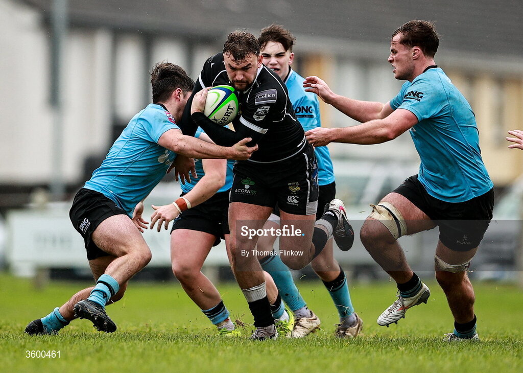 24 October 2026; Ben Moxham of Ballymena in action against Galwegians players Tom Walsh, left, Ollie Worth, back, and Bobby Power, right, during the Energia Men's All-Ireland League Division 2A match between Galwegians and Ballymena at Crowley Park in Galway. Photo by Thomas Flinkow/Sportsfile