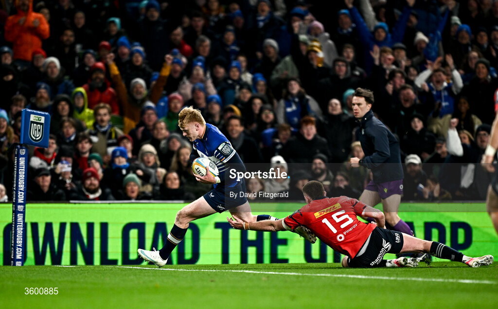 24 October 2026; Tommy O'Brien of Leinster goes over to score his side's opening try despite the tackle of Ben O'Connor of Munster during the United Rugby Championship match between Leinster and Munster at the Aviva Stadium in Dublin. Photo by David Fitzgerald/Sportsfile